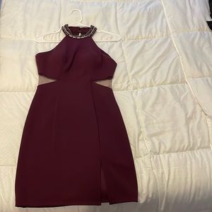 Plum colored cocktail dress with stone detail on collar, mesh side cutouts